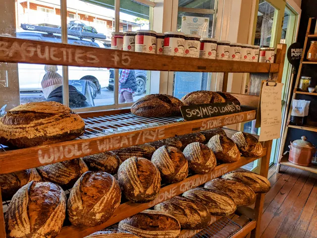 Sourdough loaves on the timber bread shelf.