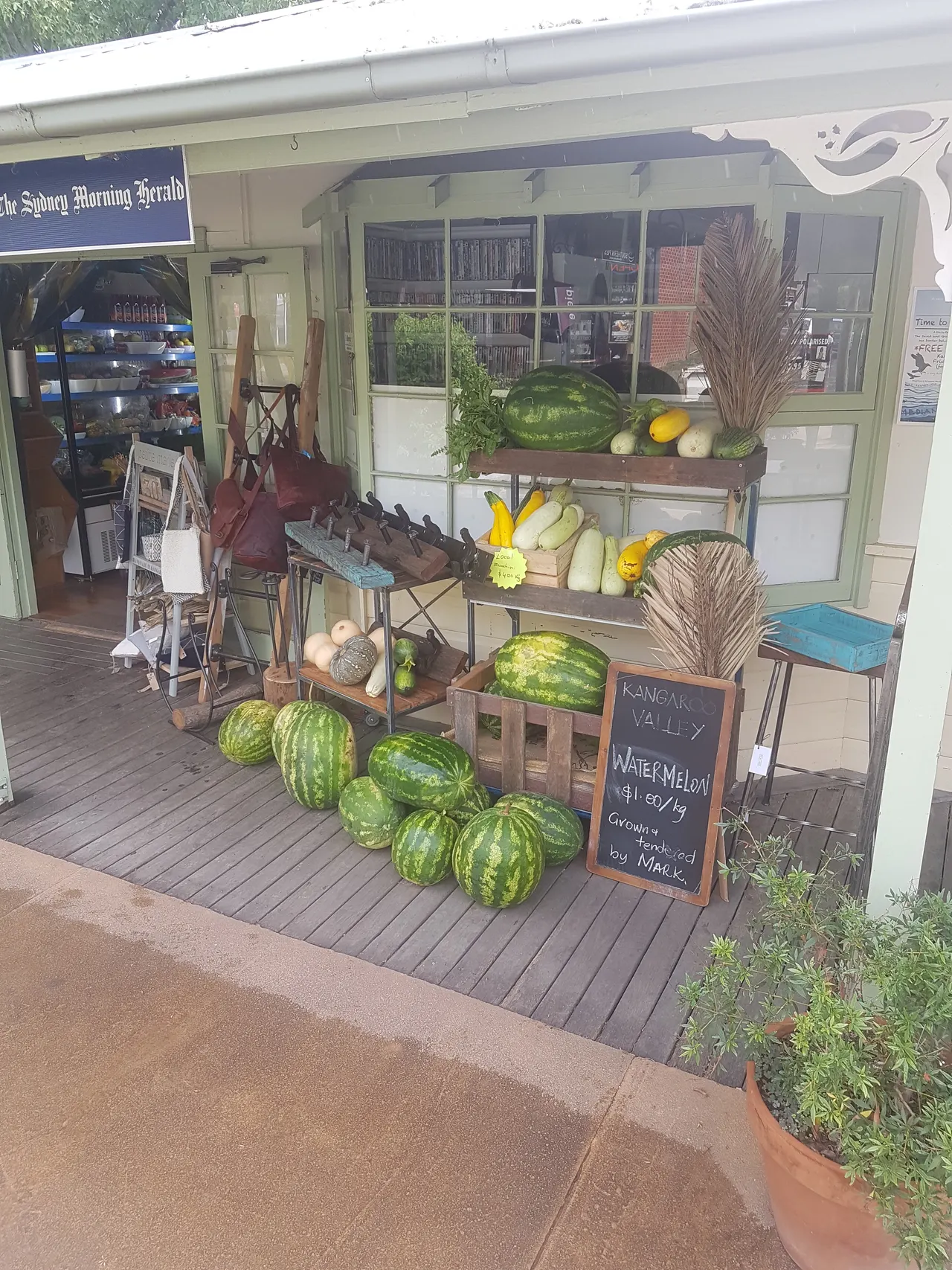 Watermelons stacked on the verandah.